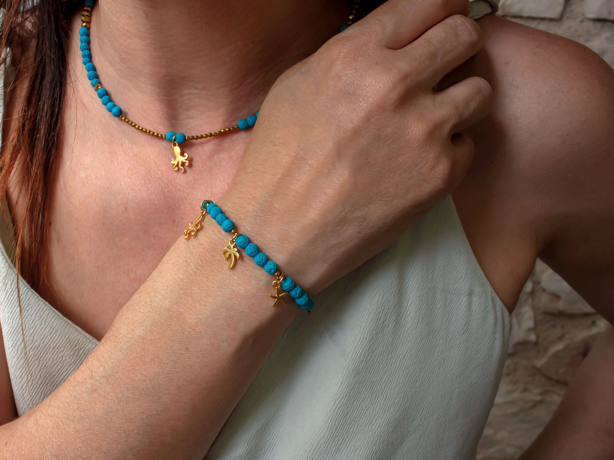 bracelet with gold-plated 24K elements and lava beads